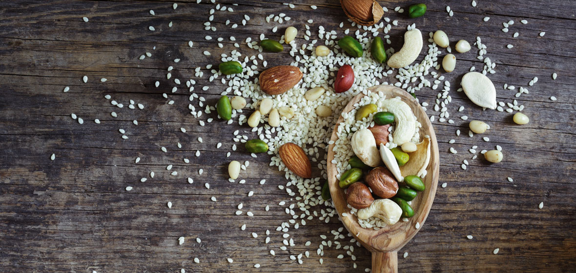 Wooden spoon with seeds and nuts
