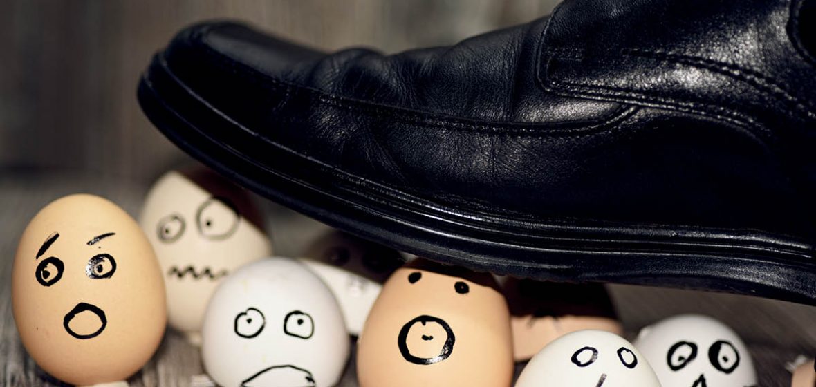 Foot treading on eggshells