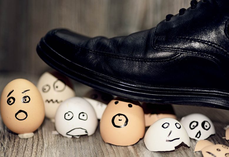 Foot treading on eggshells