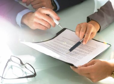 Two people reviewing a document