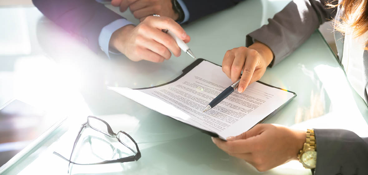 Two people reviewing a document