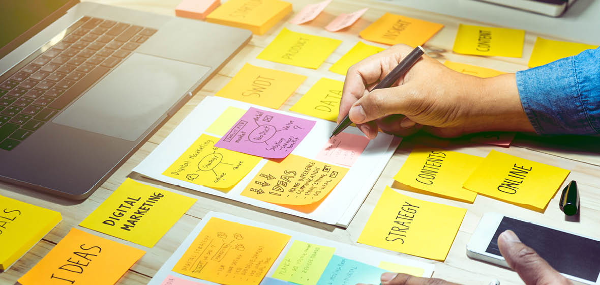 Desk covered with post-it notes