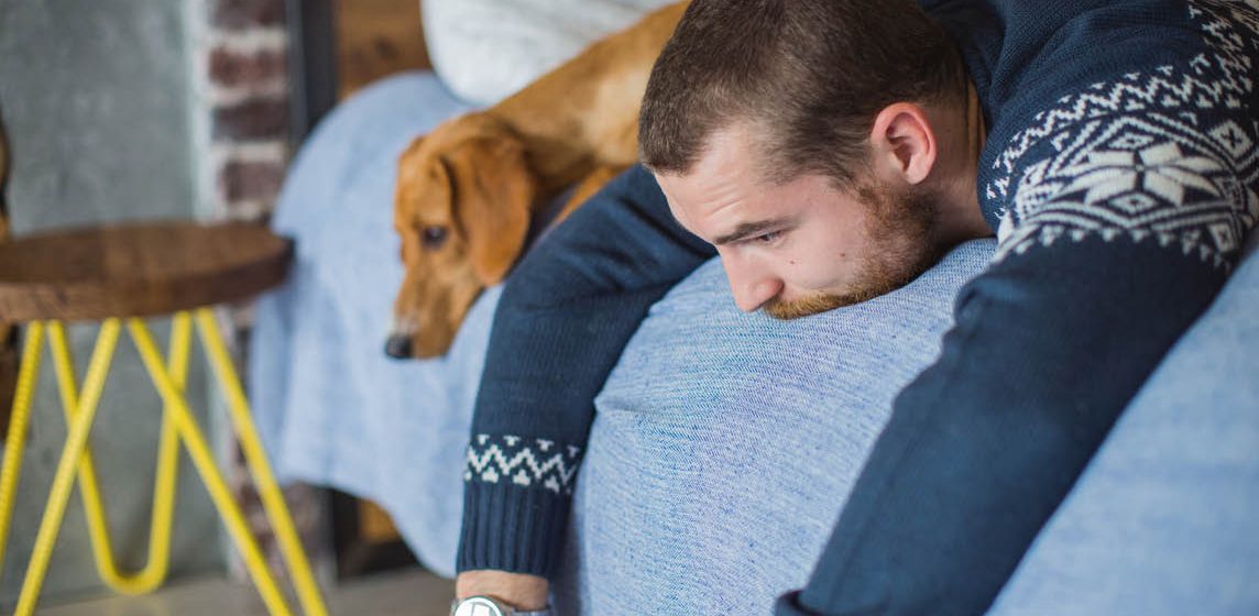 man on bed sad