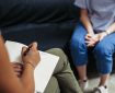 Psychotherapy session, woman talking to his psychologist in the studio