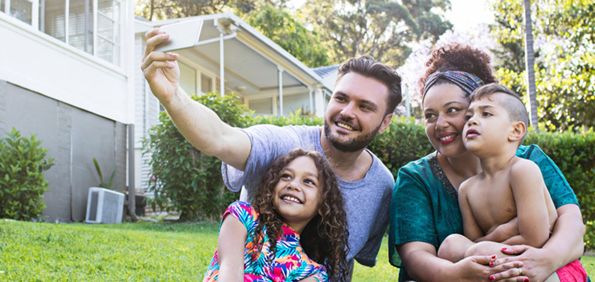 Family taking photos in their backyard