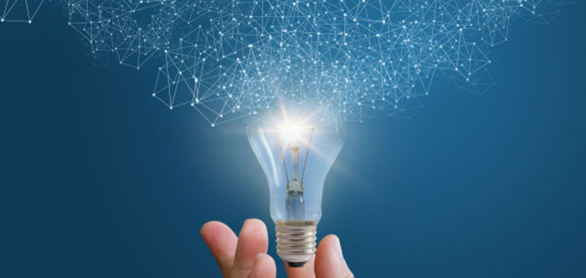 Hand holding light bulb
