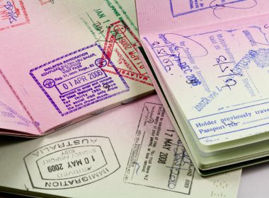 set of passports with visa and immigration stamps