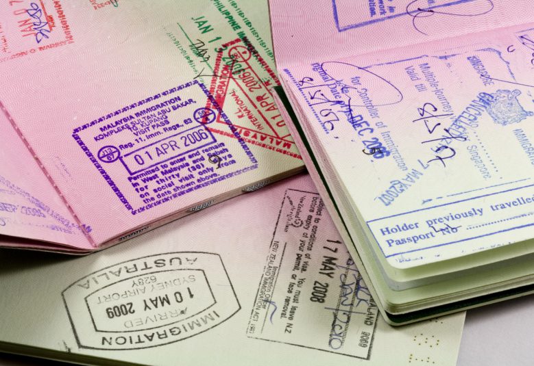 set of passports with visa and immigration stamps
