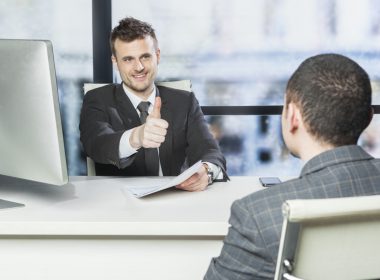 Employee gets thumbs up from manager during performance review