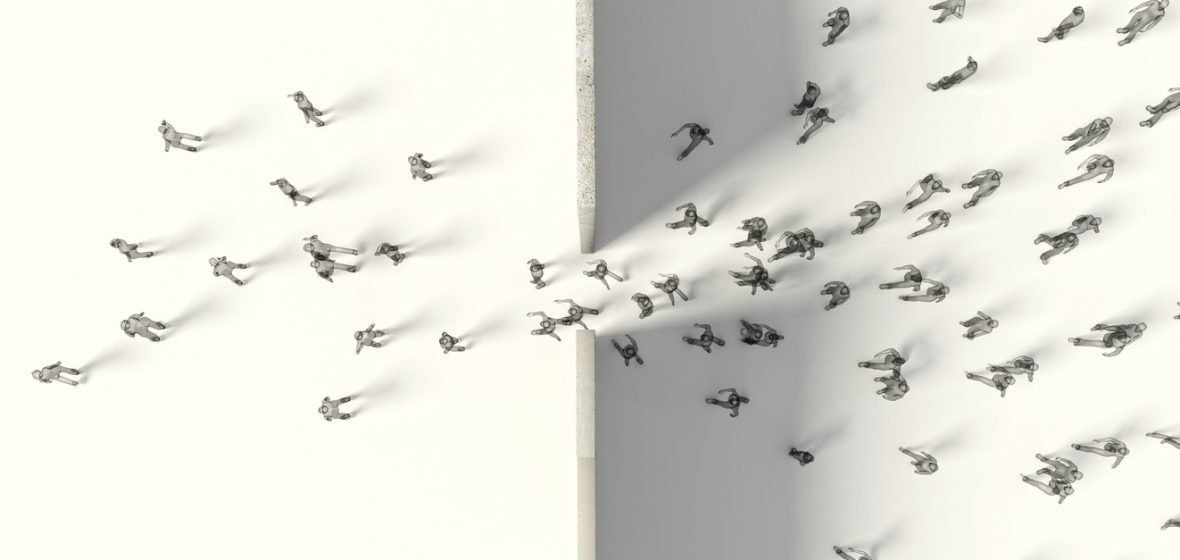 aerial view of people walking through a gap in a dividing wall
