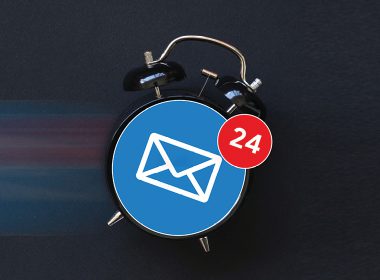 Old fashion alarm clock with email icon on clock face