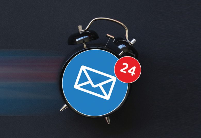 Old fashion alarm clock with email icon on clock face
