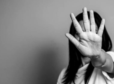 Woman holds her hand up to say stop
