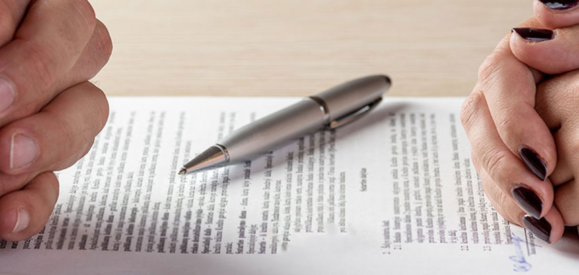 Couple looking at a divorce document