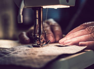 Vulnerable worker uses a sewing machine