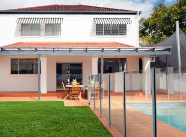 Backyard swimming pool with fence