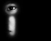 Child looking through a keyhole