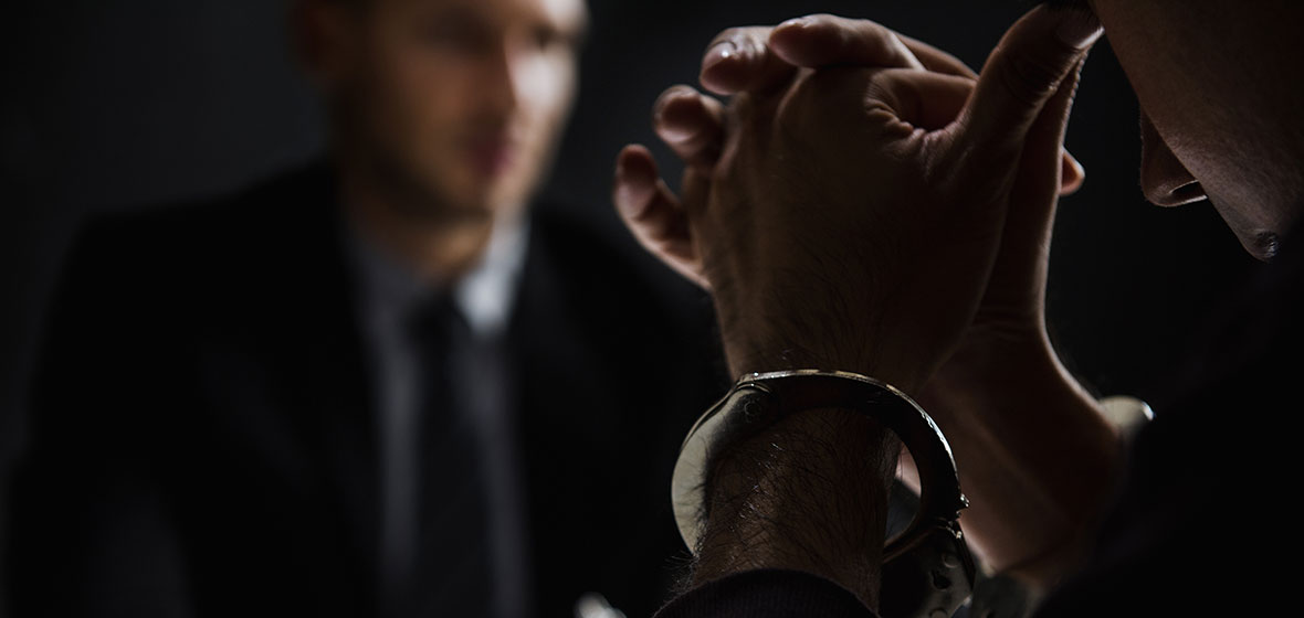 Cuffed prisoner gives testimony