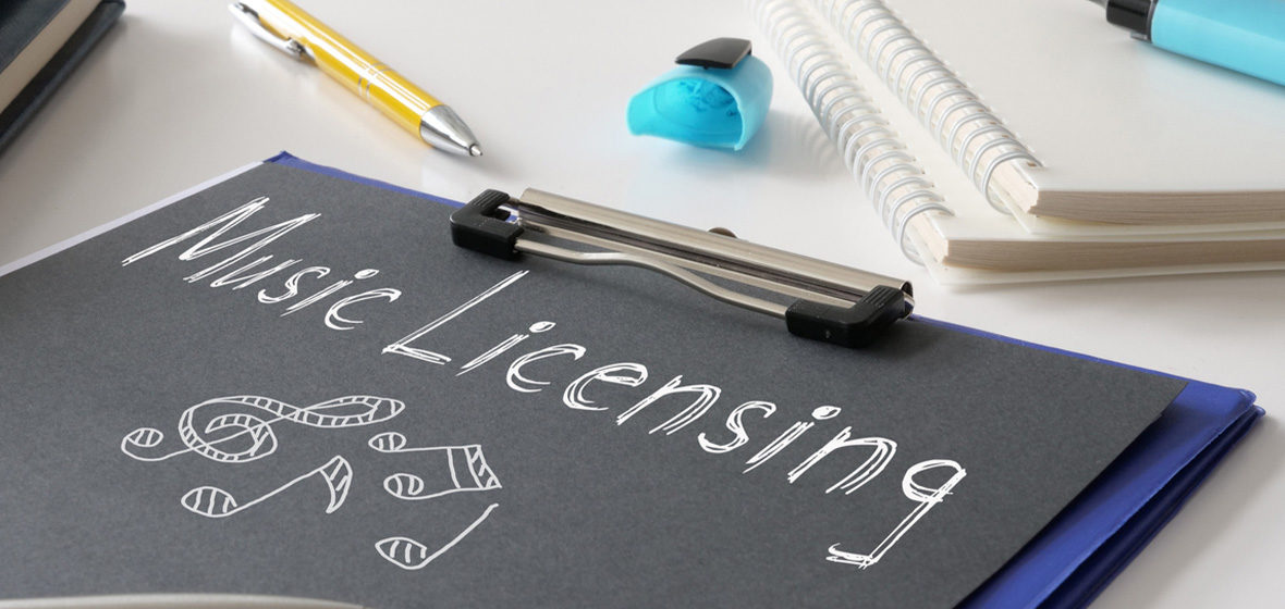 pens and file with words music licensing