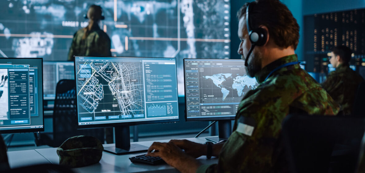 photo showing man in military camouflage doing data surveillance