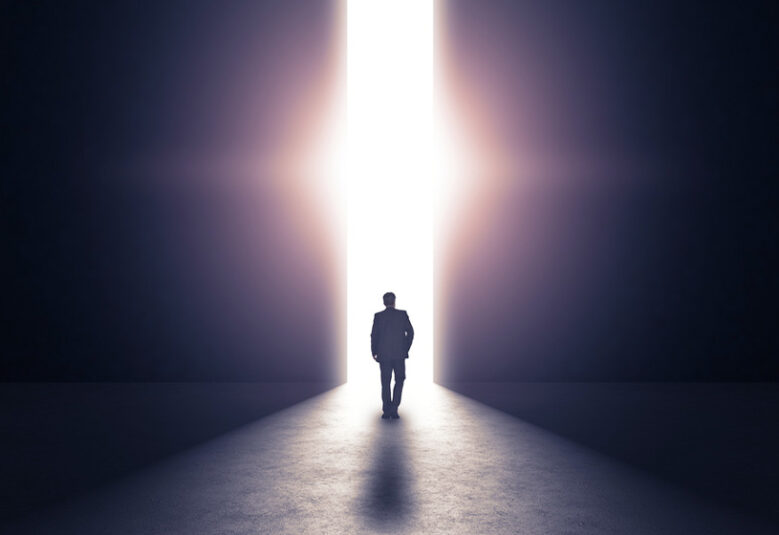 [image] man working towards a lighted doorway to show possibility of hope through drug courts