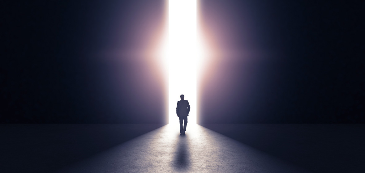 [image] man working towards a lighted doorway to show possibility of hope through drug courts