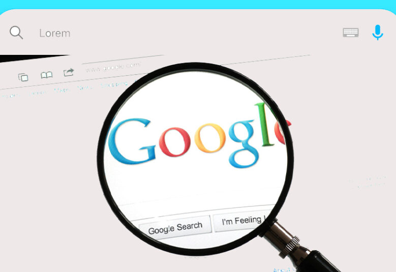 image of magnifying glass on computer screen highlighting the word google