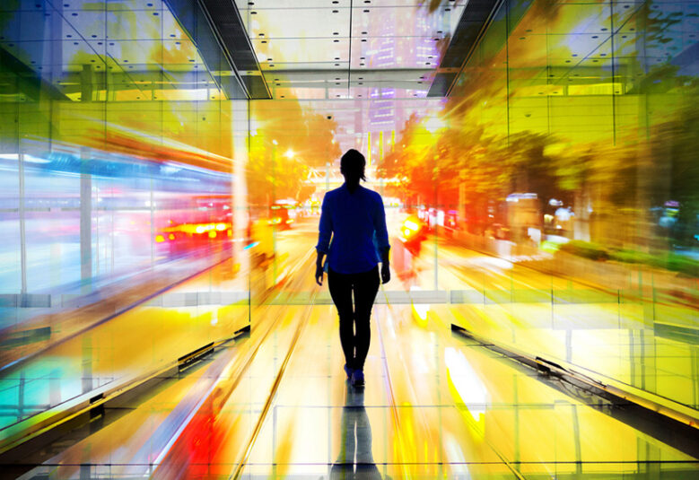 image of women walking towards the light in a colourful tunnel